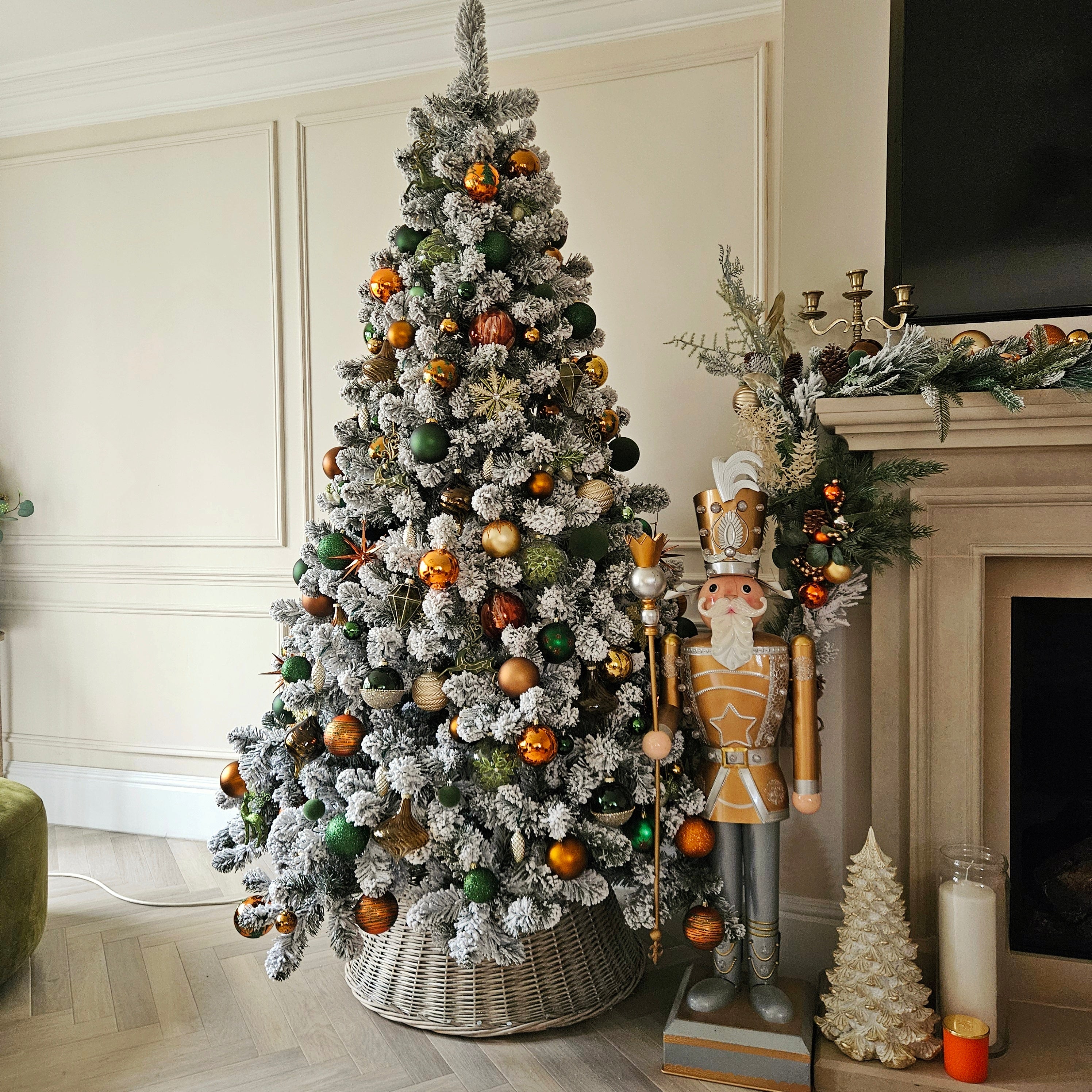 7ft pre lit Christmas tree with warm white LED lights – snow flocked in a living room setting

